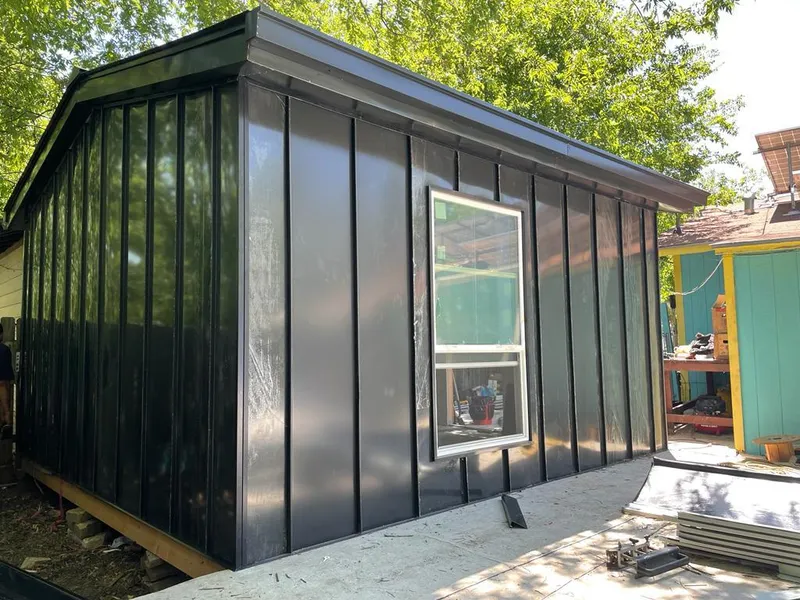 Black standing seam metal wall panels for Metal Roof Installation in Pampa